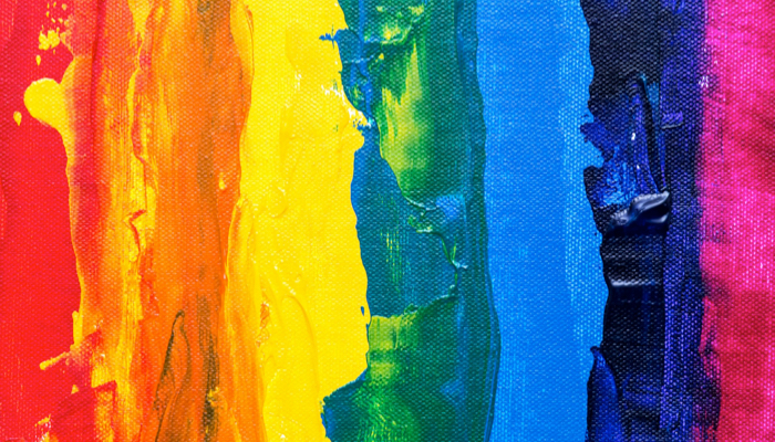 Textured rainbow paint on a canvas