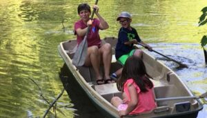 a family in a row boat