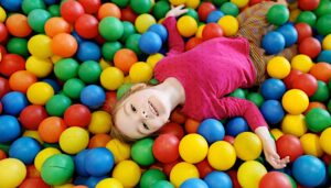 girl in ball pit