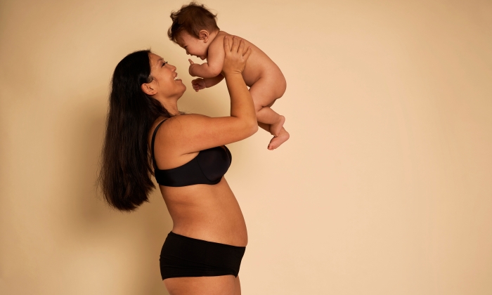 New mom praises her postpartum body in all its adult diaper