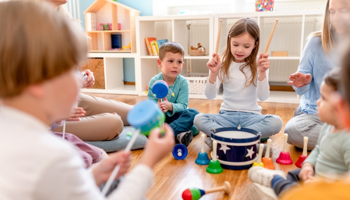 Preschool children with instruments on a music class.