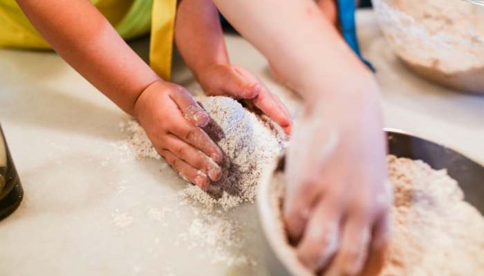A Child Baking on a Kitchen Counter