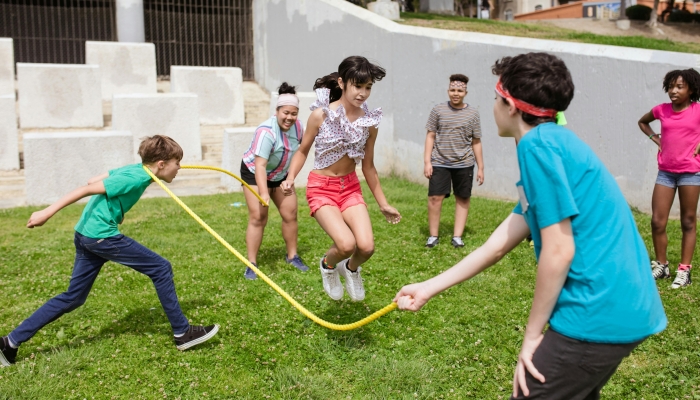 A Group of Kids Playing Jumping Rope