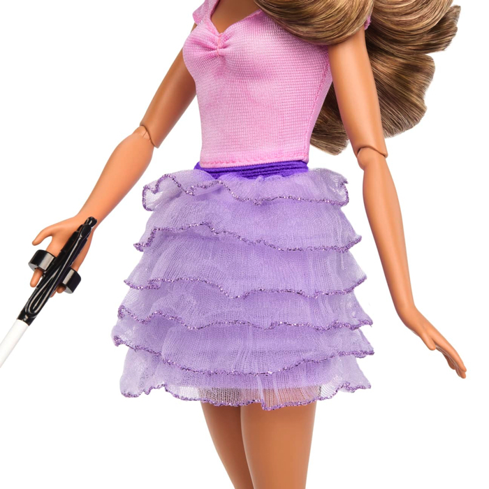 Blind barbie with articulated elbows and white cane.