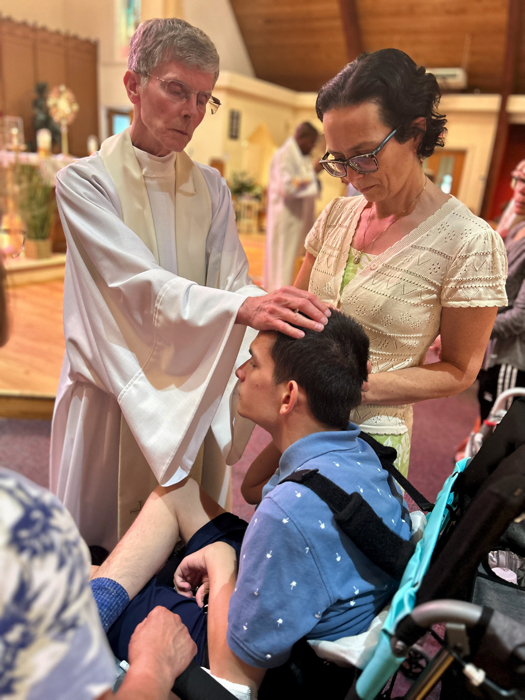 Ivan at a healing service being prayed over.