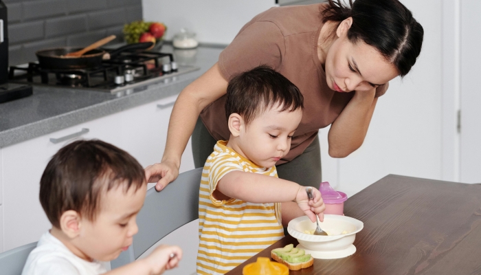 Mother and Sons in a Kitchen