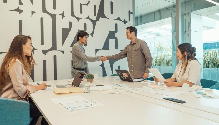 A Group of People Having a Meeting in the Office