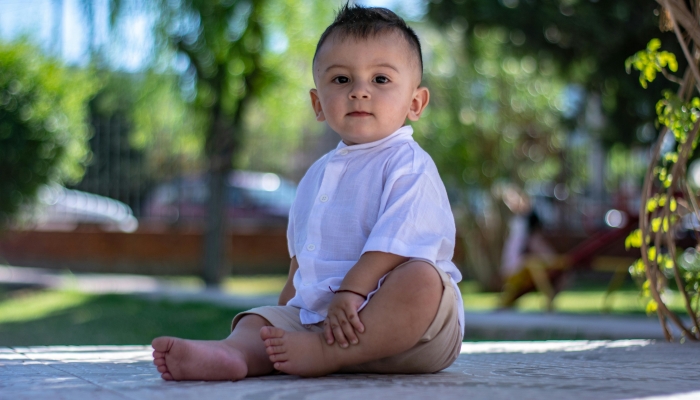 Child Model Posing in Shorts and Elegant Shirt