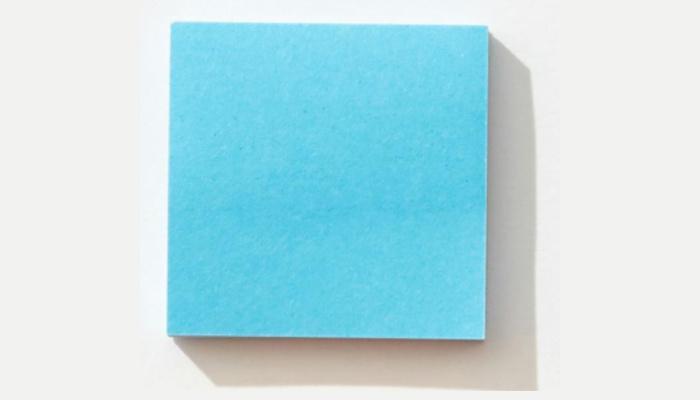 Blue paper square on white background.