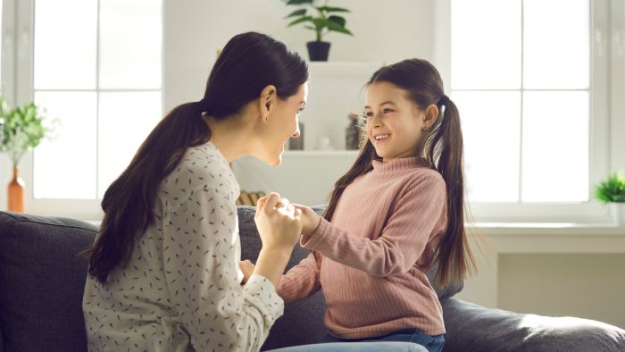 Mom and daughter having a conversation.