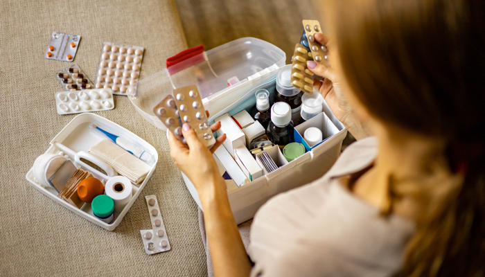 A mother organizing medication.